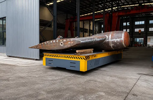 Rudder stock on a transfer cart outside the production hall