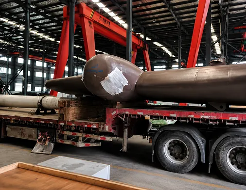 Rudder stocks loaded on a trailer inside the production hall